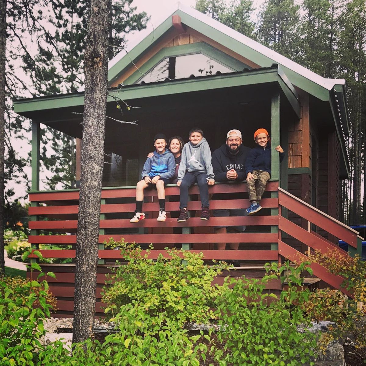 The Puglisi family outside their lodge.