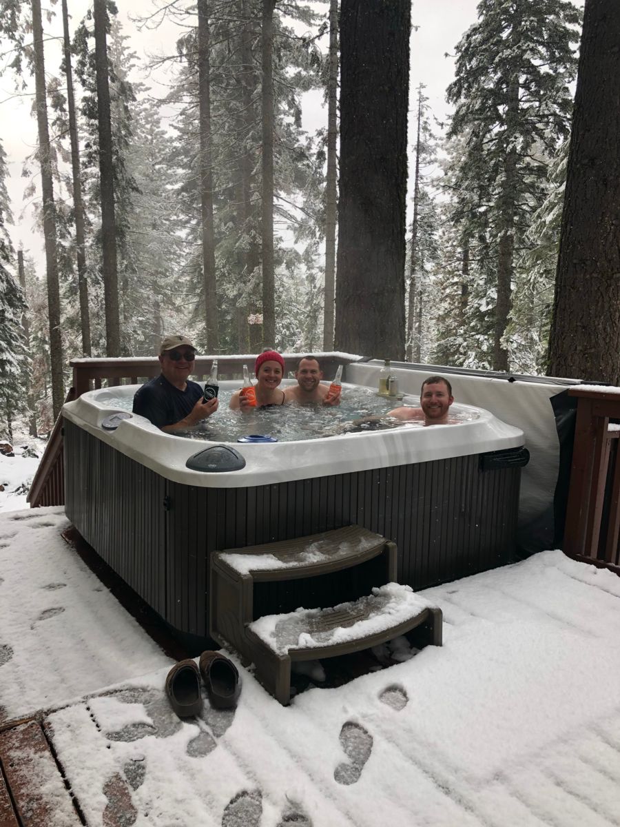 Enjoying a drink in the hot tub during a gentle snow