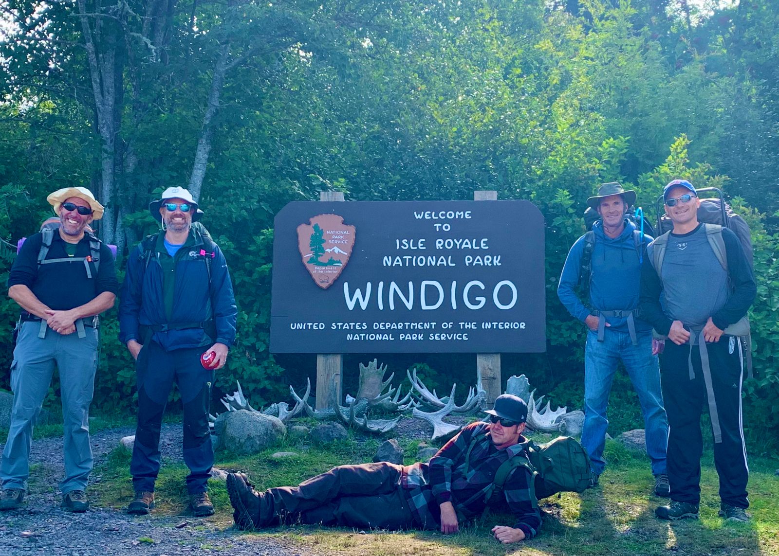 Bryan and his camping buddies pose for obligatory photo in front of Isle Royal sign upon arrival.