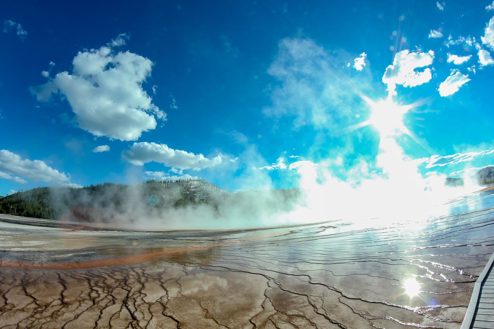 Algae mats, water runoff and steam make for stunning pictures of the thermal features. Photo © Tino Woodburn.