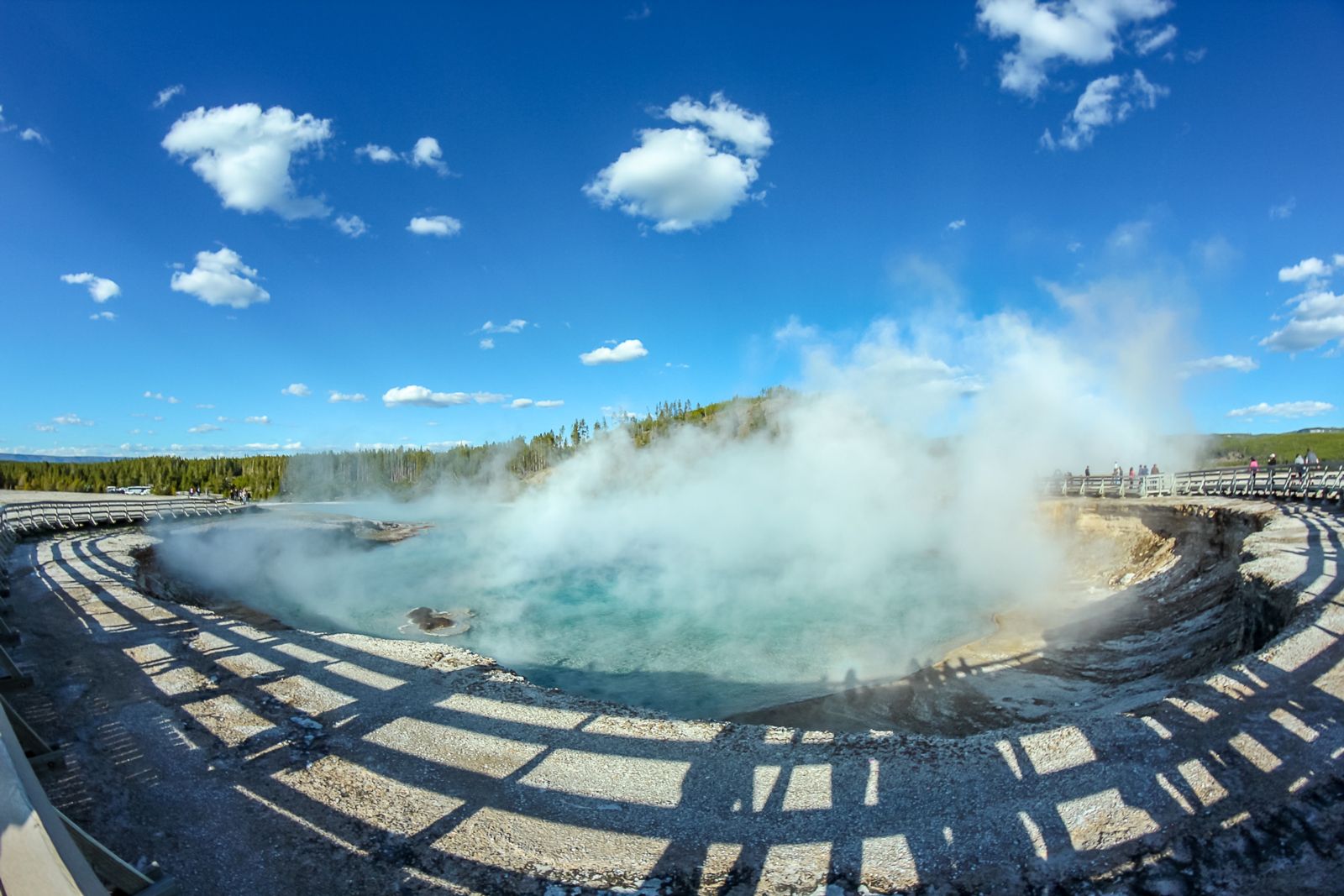 Shadows and clouds make art around the thermal features. Photo © Tino Woodburn.